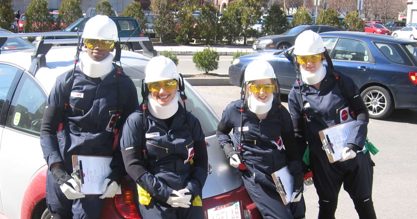 Researchers wearing the AGNES suit near an AgeLab car