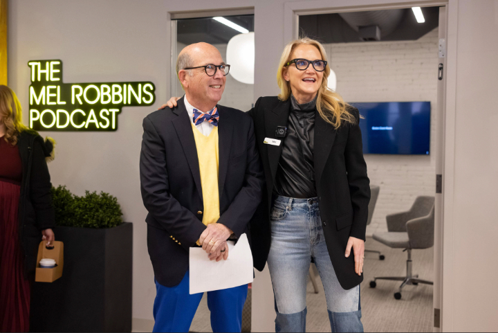 Coughlin, left, standing with Robbins in the studio